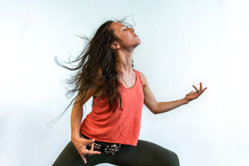 A trendy rock chick is seen celebrating life during an up tempo gym session, seen in an air guitar...