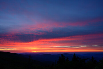 Fototapeta na wymiar Sunset Over Pines and Mountains