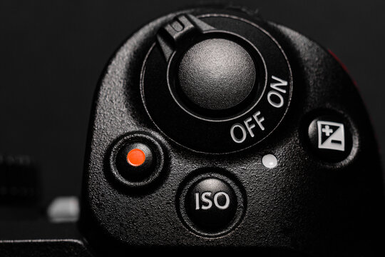 Shutter button and camera power button close up, rear view of the camera.