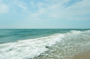 Clear sea water, wave and sand beach.