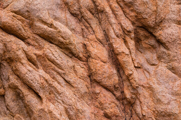 Close-up red textured granite rock, west coast corsica. Perfect as texture or background. High quality photo