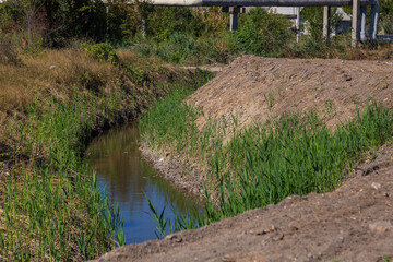 Drainage channel for rainwater on the outskirts of the city