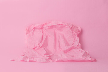 Monochrome image with blank space on crumpled paper on a pink background for your product. Pastel shades. Minimal concept.
