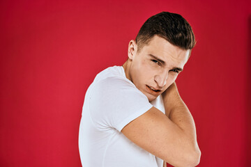 Man in white t-shirt emotions displeased facial expression isolated background