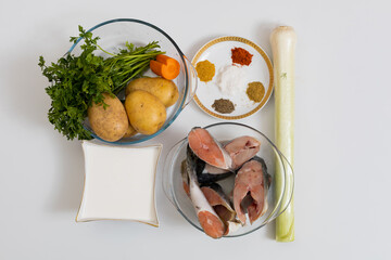 Vegetables and salmon for fish soup. Culinary background with selective focus