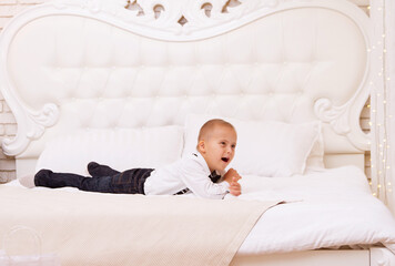 Boy with Down syndrome jumping on the couch, genetic abnormality, extra chromosome, x chromosome,...