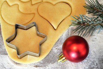 Preparing Christmas cookies. Gingerbread dough and cookie cutter