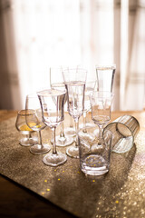 Several champagne glasses over gold christmas background. Celebrating new year concept.