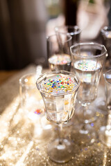 Several champagne glasses over gold christmas background. Celebrating new year concept.