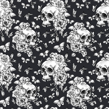Vintage seamless pattern with goth skull, butterdlies and flowers