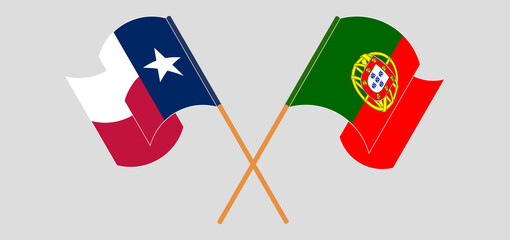 Crossed and waving flags of Portugal and the State of Texas