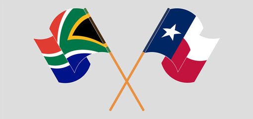 Crossed and waving flags of Republic of South Africa and the State of Texas