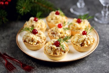 Tartlets with cod liver, egg and cheese.