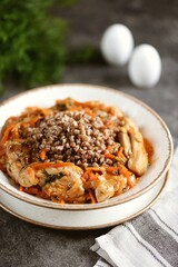 Stewed chicken with onions, carrots, tomato sauce and buckwheat.