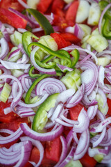 Sliced onions, peppers, various vegetables close-up. The view from the top