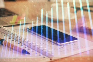 Double exposure of forex chart drawing and cell phone background. Concept of financial data analysis