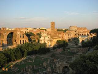 Rome, Italy - A panoramic view of the Roman Forum, a major tourist attraction featuring ancient government buildings at the center of the city of Rome.  Image has copy space.