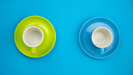 Top view Colorful coffee cup on blue paper background.