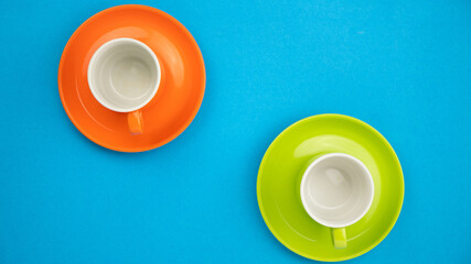 Top view Colorful coffee cup on blue paper background.