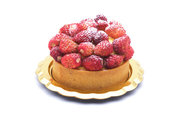 Strawberries and cream cake or small round cake. Delicious sweet desert, mostly red and yellow. Sophisticated italian or french patisserie, small pastry for big rewarding pleasure. Isolated on white.