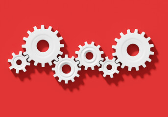 Many white connecting gear cogs of different sizes isolated on red background; flat lay, close up, top view, copy space; 3d rendering, 3d illustration