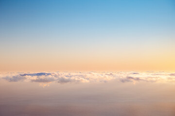 Spectacular moment of the azure sky at sunrise with clouds.