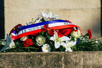 Closeup of wreath of flowers at the Armistice commemoration ceremony during the coronavirus epidemic and the lockdown to impose containment of the population