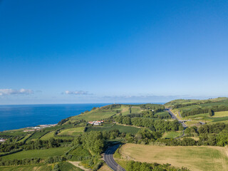 Fototapeta na wymiar Aerial top view landscape in the North Coast of São Miguel Island. Road path background. São Miguel Island, Azores