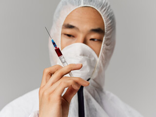 male laboratory technician protective clothing vaccine development medicine