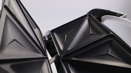 sandwich maker close-up on a light background