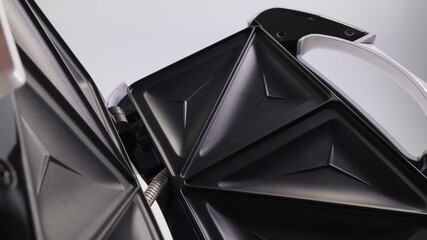 sandwich maker close-up on a light background