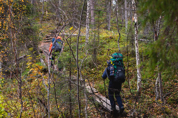 Autumn view of Oulanka National Park, landscape, a finnish national park in the Northern Ostrobothnia and Lapland regions of Finland,  wooden wilderness hut, cabin cottage, bridge, campground place