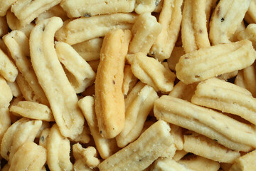 Ganthiya (Fried spicy chickpea flour sticks). View from above on sticks pile. Closeup