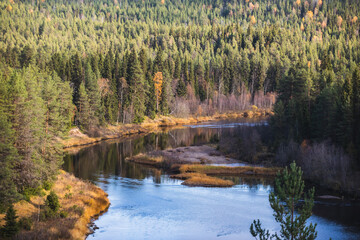 Fototapeta premium Autumn view of Oulanka National Park, landscape, a finnish national park in the Northern Ostrobothnia and Lapland regions of Finland, wooden wilderness hut, cabin cottage, bridge, campground place