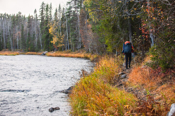 Autumn view of Oulanka National Park, landscape, a finnish national park in the Northern Ostrobothnia and Lapland regions of Finland,  wooden wilderness hut, cabin cottage, bridge, campground place