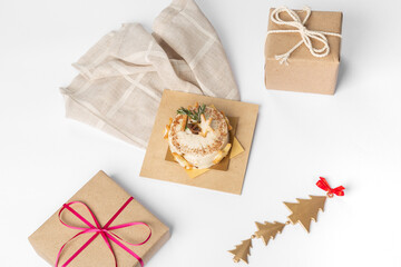 Dessert pastry on wooden plate with Christmas decoration