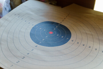 Close up on paper target at shooting range