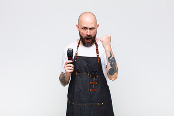 bald man shouting aggressively with an angry expression or with fists clenched celebrating success