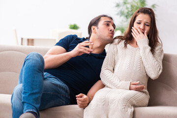 Fototapeta na wymiar Man and pregnant woman in antismoking concept