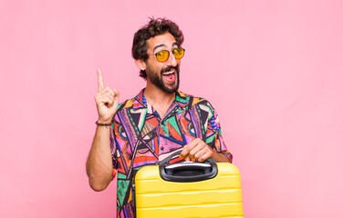 young bearded man feeling like a happy and excited genius after realizing an idea, cheerfully...