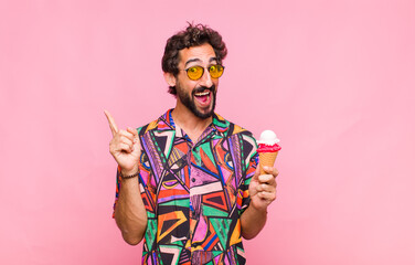 young bearded man feeling like a happy and excited genius after realizing an idea, cheerfully...