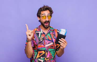 young bearded man feeling like a happy and excited genius after realizing an idea, cheerfully...