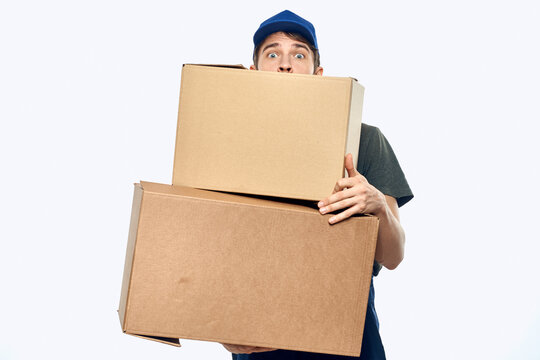 Working man with boxes in hands delivery service work lifestyle