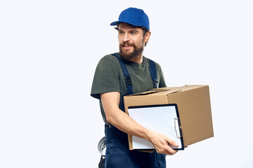 Working male courier with box in hand documents delivery service light background