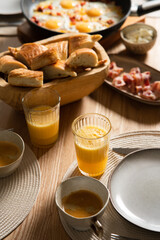 bacon, bread, coffee and orange juice for Breakfast. Table setting in Scandinavian style