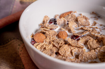 Exquisite whole grain dish with almond, coconut and blueberries on top.
