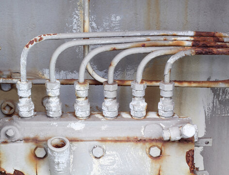 close-up of old steam trap valve on pipe connection