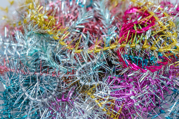 Greeting christmas card with multicolored vintage tinsel textured background