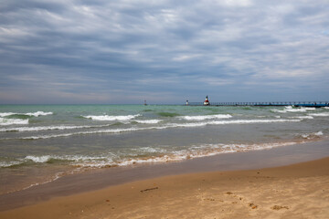 St. Joseph North Pier Lighthouse and Lake Michigan beach in Fall.