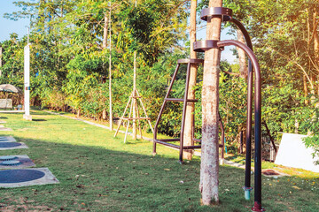 Black steel column supports and controls the branches and trunks of the tree to stand upright and beautiful in the park.